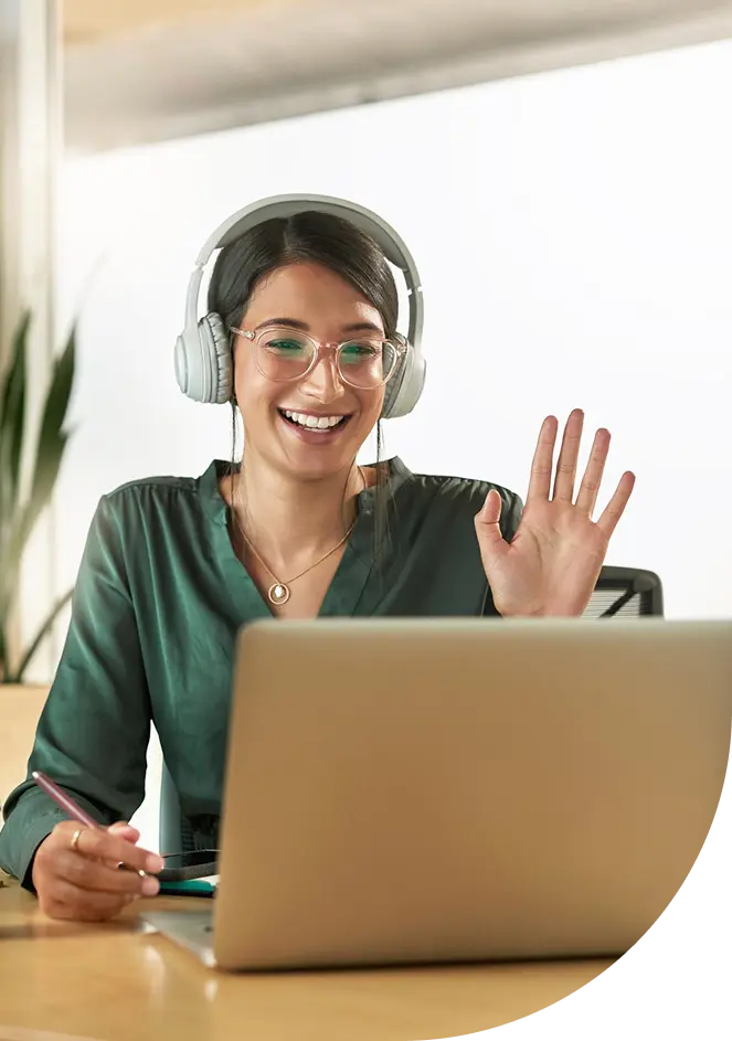 An expert waving as she joins a live exam session by video call